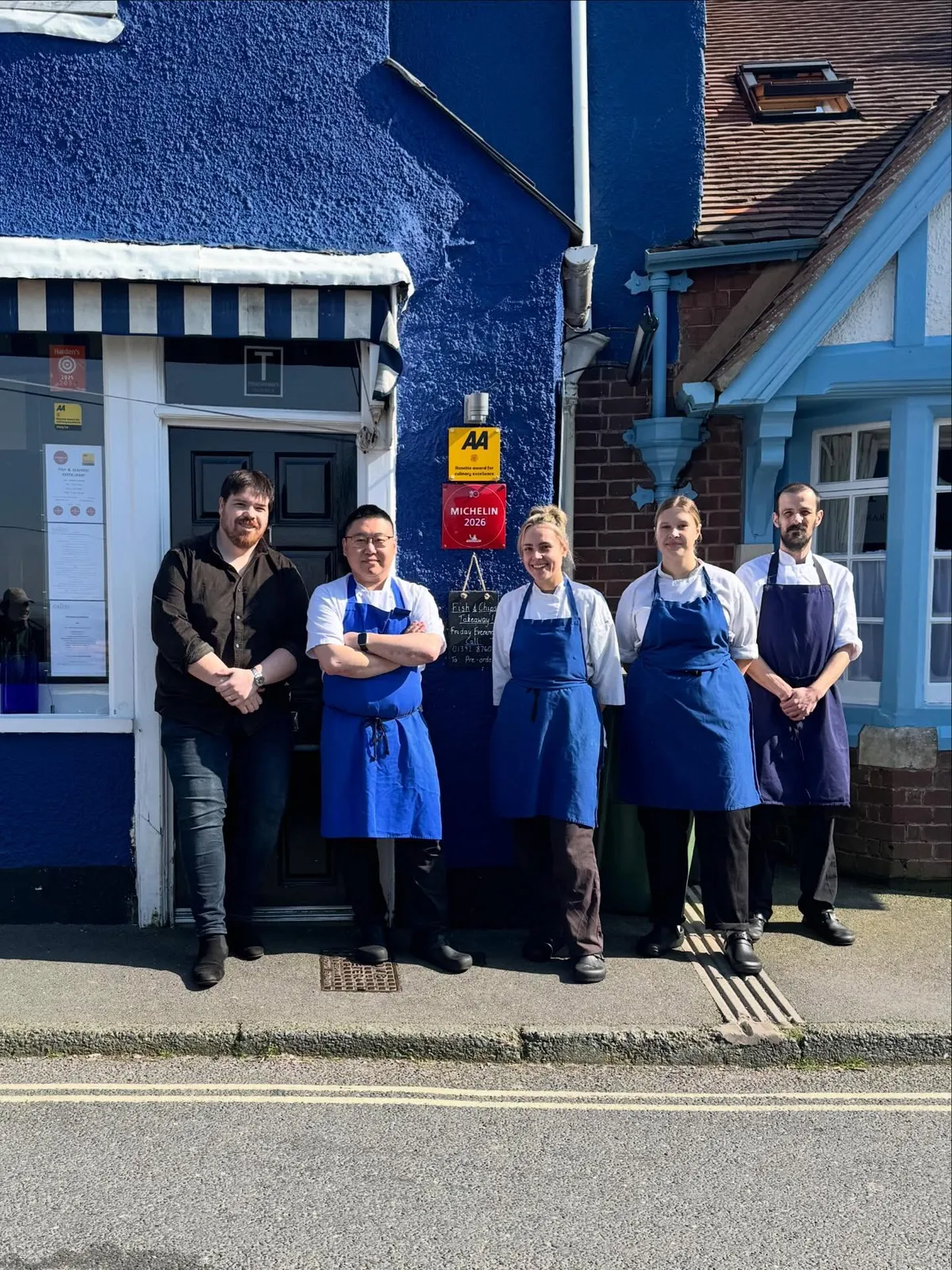 The Galley team outside the restaurant with the Michelin plaque behind