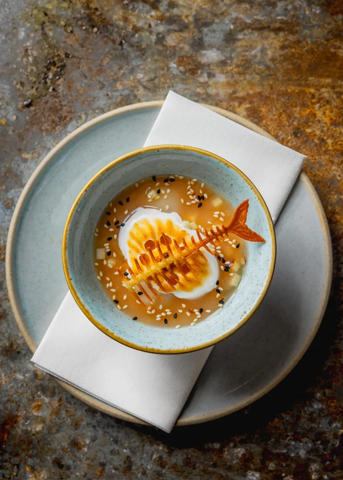 Lychee floating island — Italian meringue, mango and toasted sesame, top-down