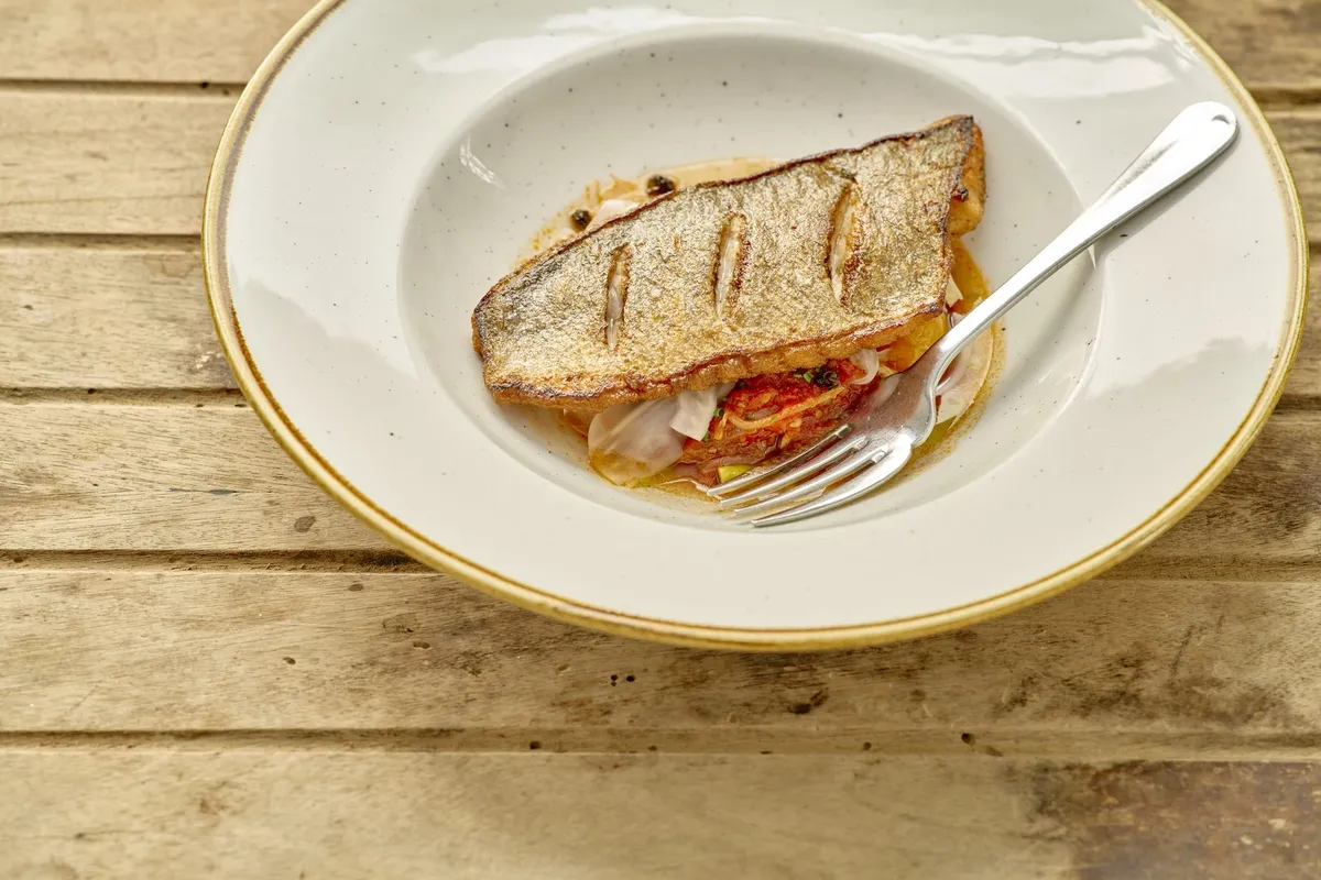 Pan-fried sea bream with puttanesca, the head chef's signature dish at The Galley