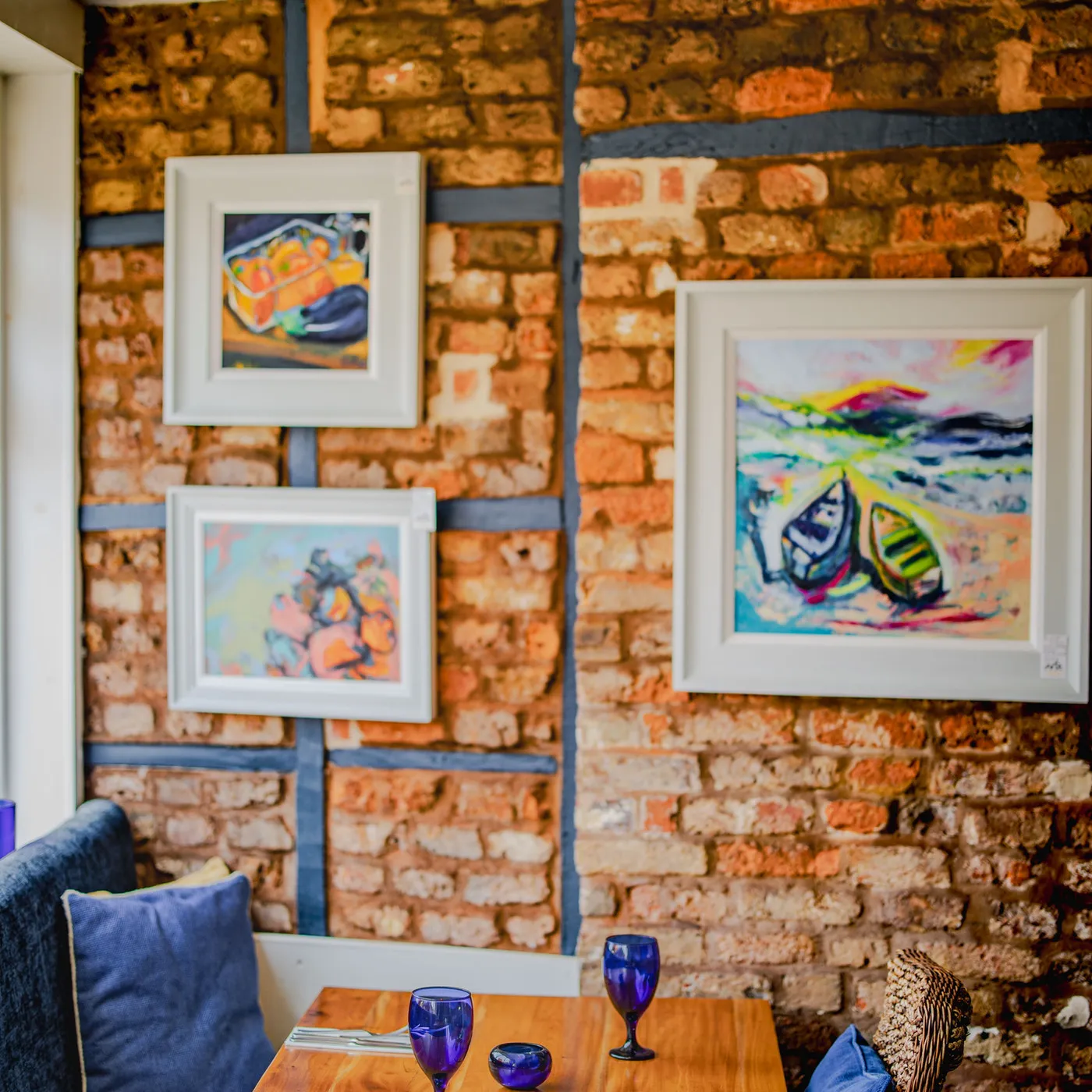 Dining room with framed local artwork